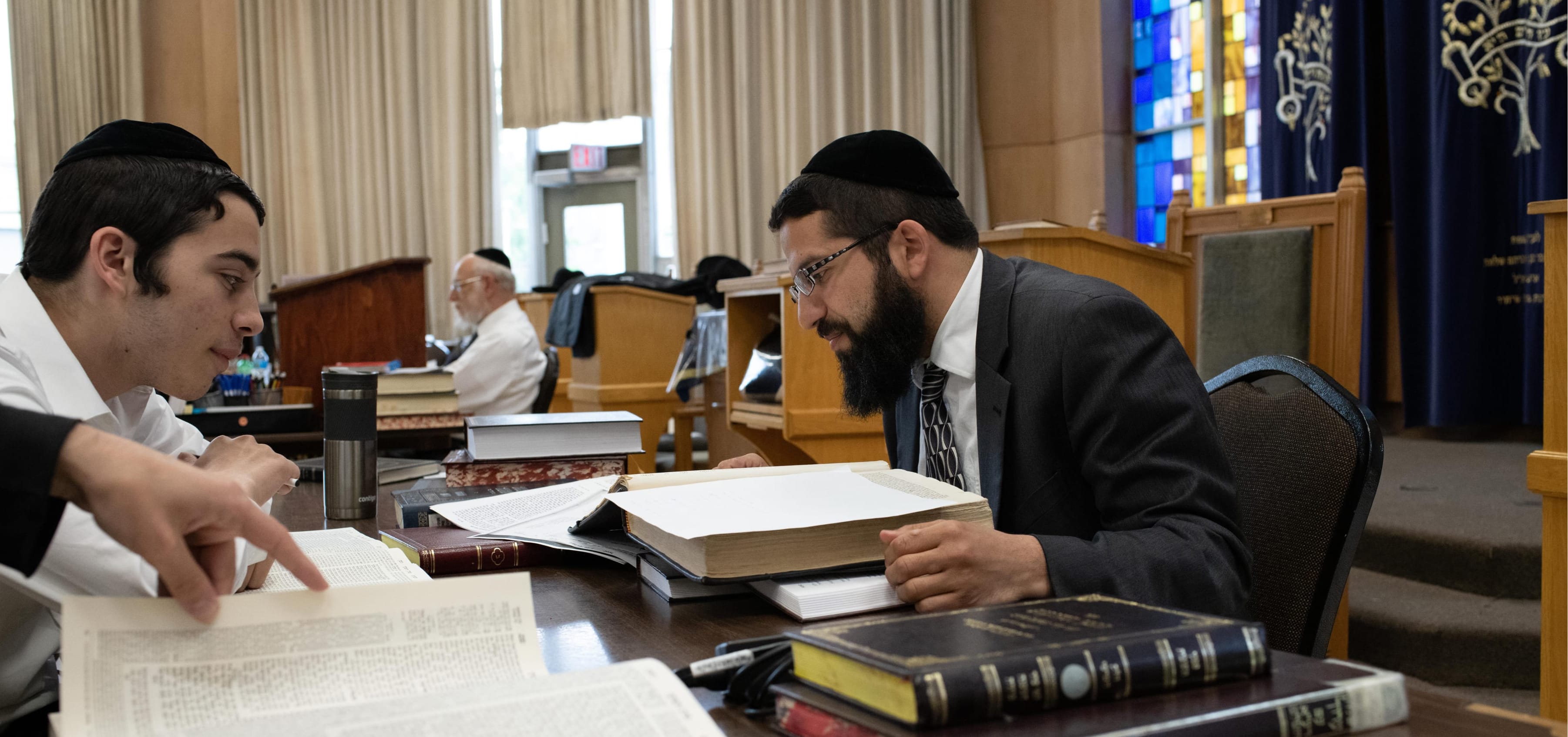 men studying torah