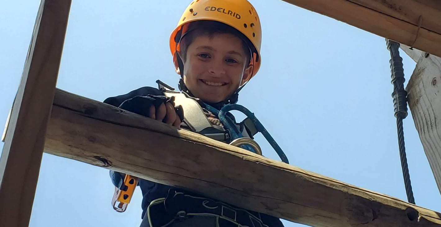 boy in hardhat at construction site