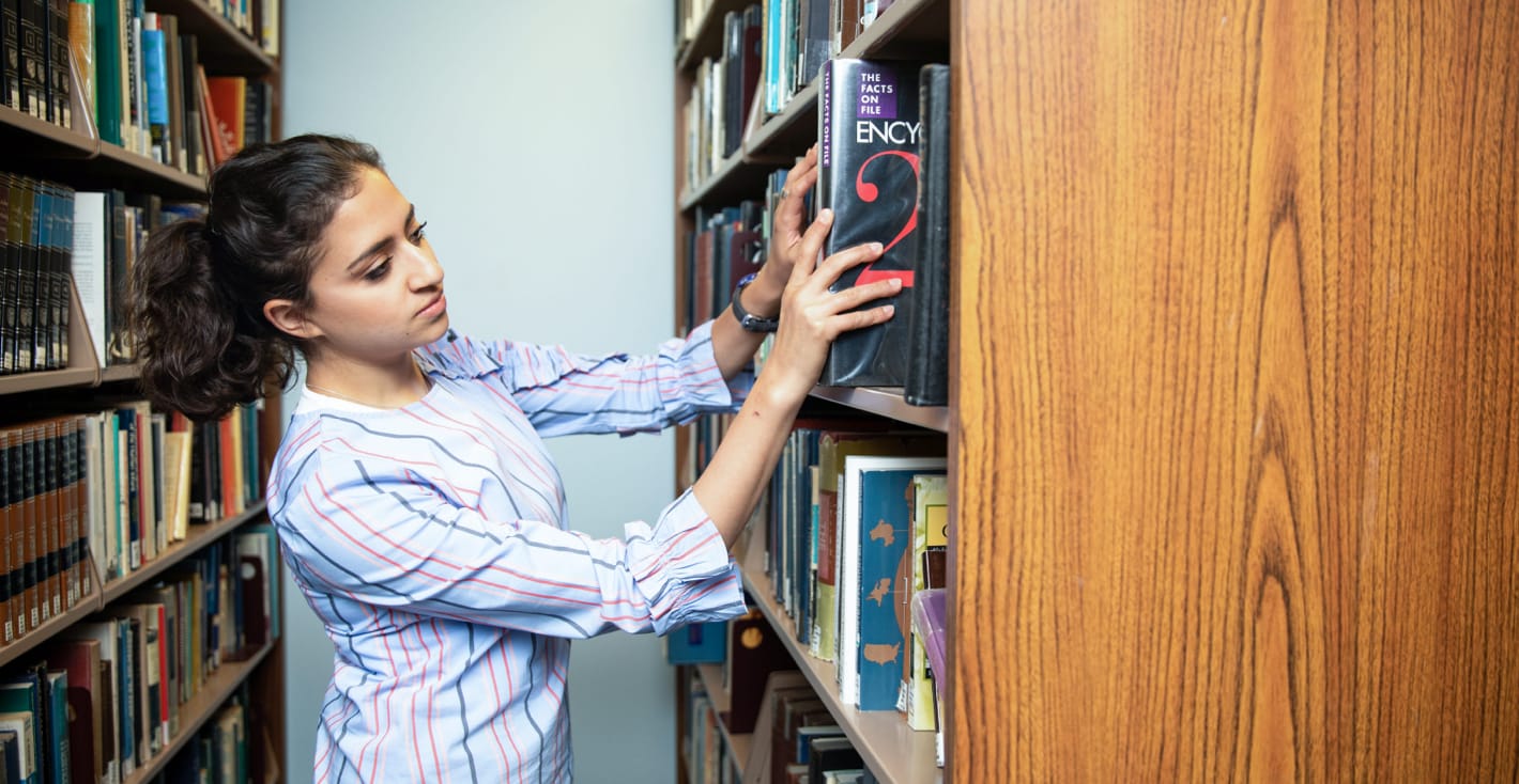 female student in library